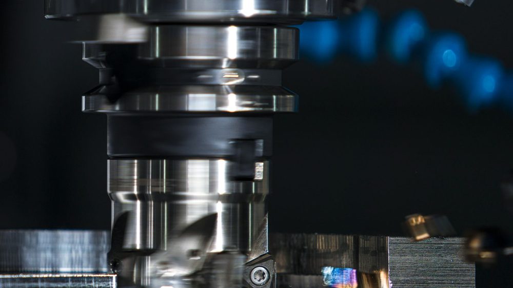 CNC milling machine cutting metal (illustrative stock photo)